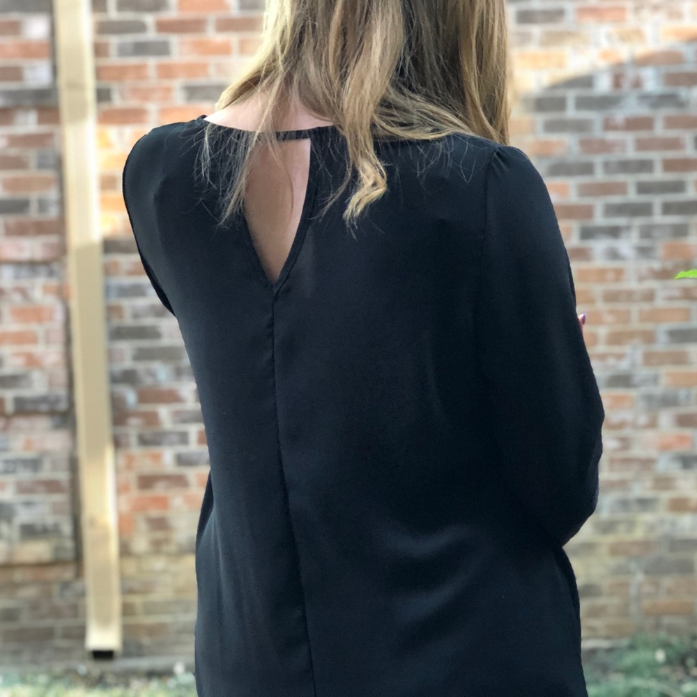 Black long sleeve blouse.